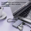 Hub USB 4 puertos Yesido HB12 con memorias USB conectadas a una laptop