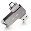 Se muestra una unidad flash USB USAMS plateada de 16 GB con conectores USB-C y USB-A, que ofrece transferencias USB 3.0 rápidas y seguras, con un conector extendido y el otro retraído.