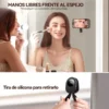 Celular sujeto frente a un espejo para seguir un tutorial de maquillaje y detalle de la tira para retirar el soporte.